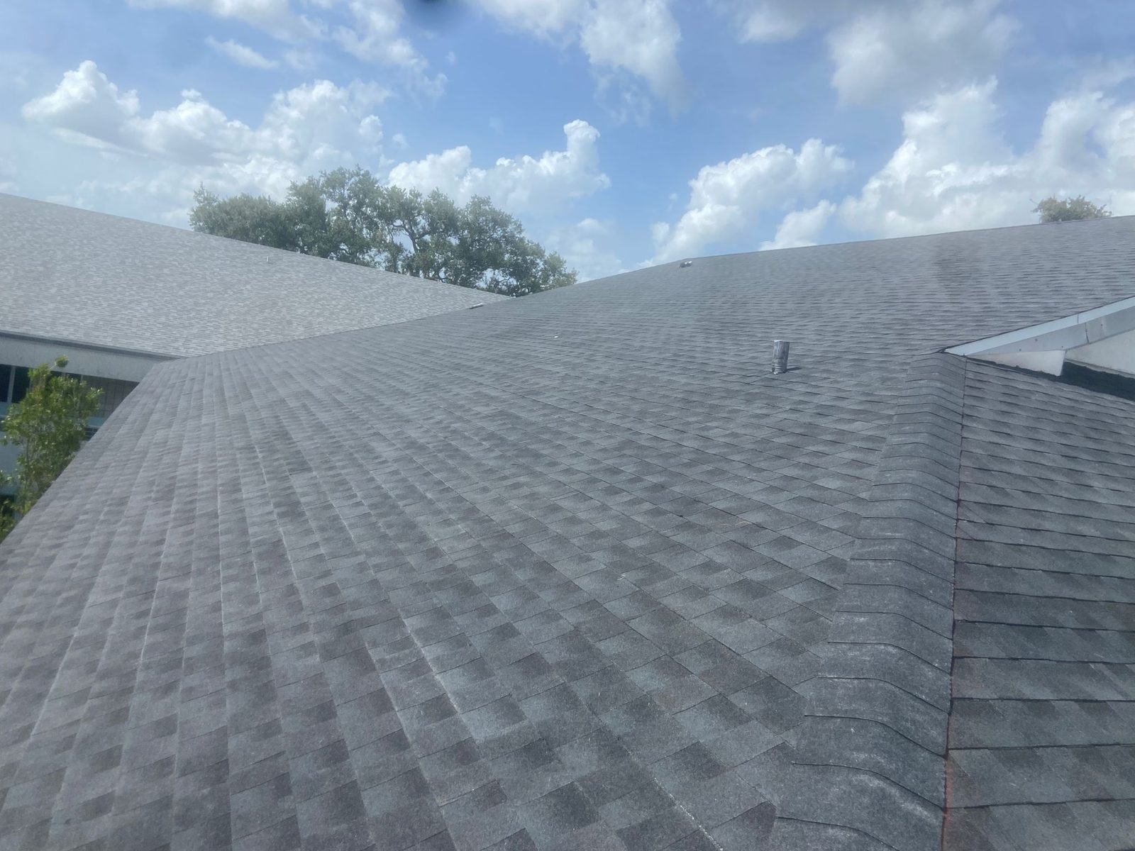 Aerial view of a completed architectural shingle roof in Zachary, Louisiana