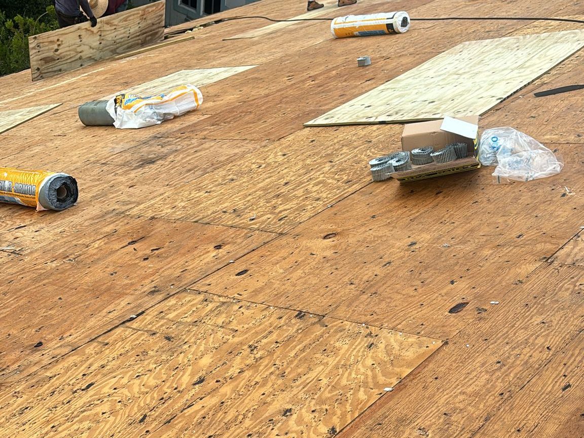 Redbird crew replacing rotten roof decking during a tear-off