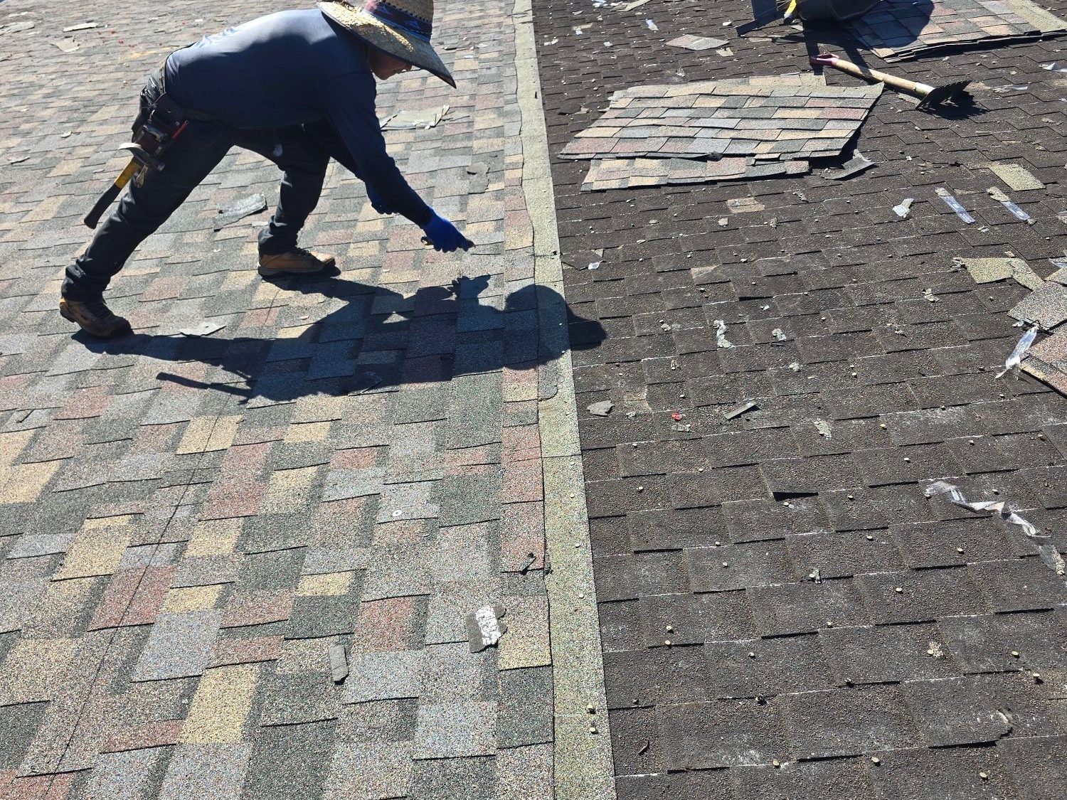 Storm damaged roof tarped before replacement in Baton Rouge